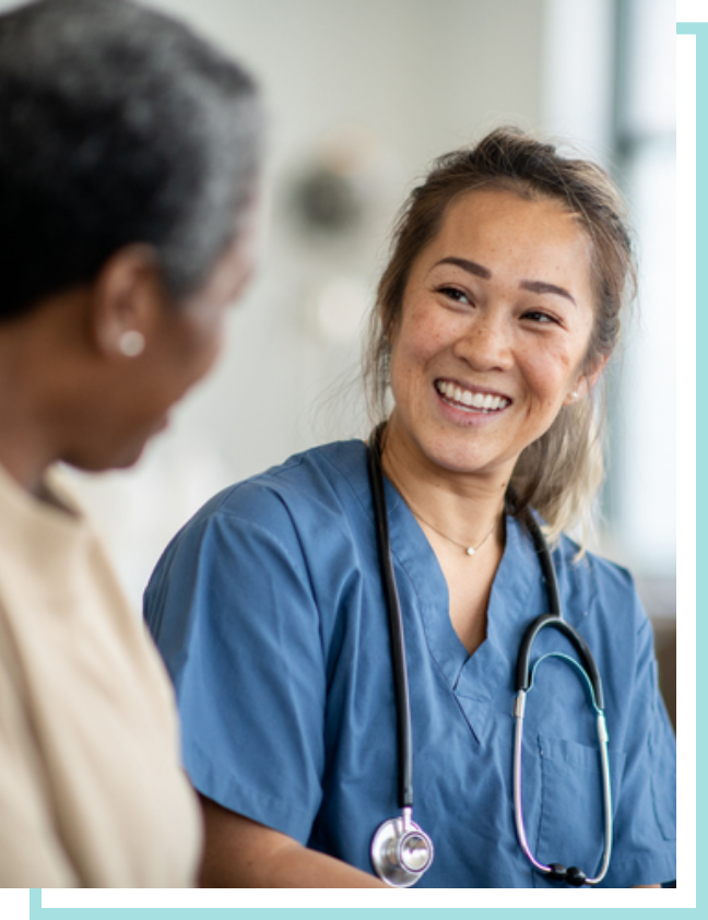 Female nurse speaking with a patient