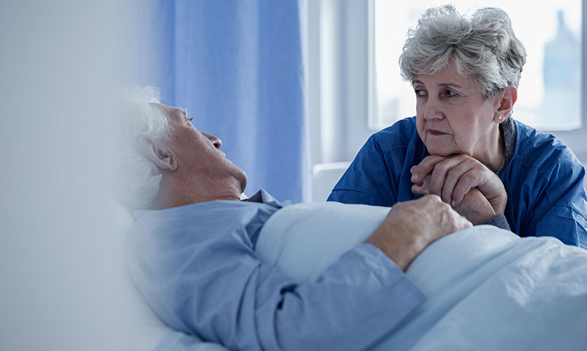 Elderly wife comforting her husband in kidney failure