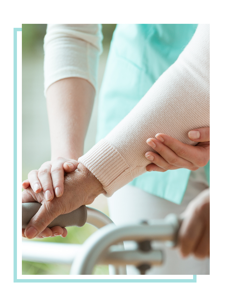 Woman supporting someone using a walker