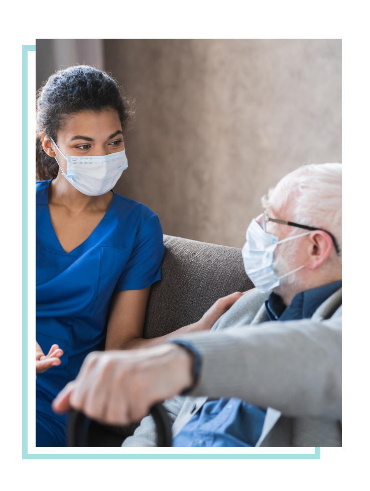 Nurse and elderly man wearing masks