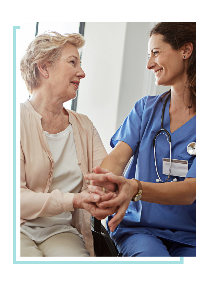 Female hospice nurse comforting a patient