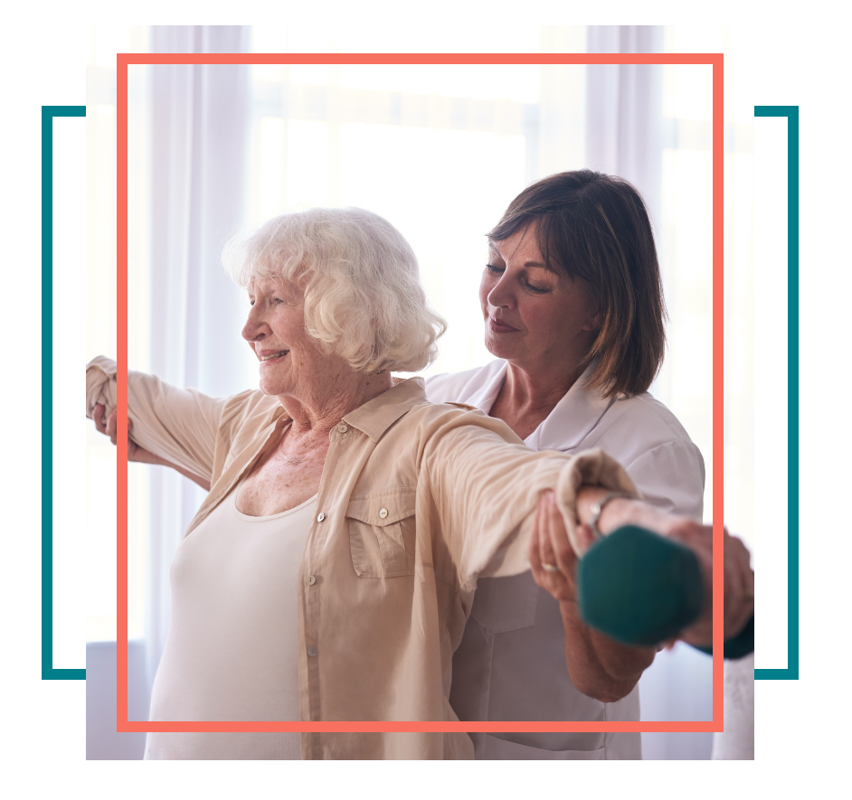 Female patient using dumbbells with physical therapist