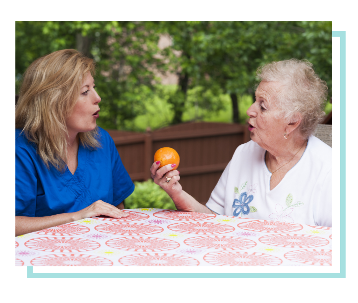 Female speech therapist and patient working on speech therapy