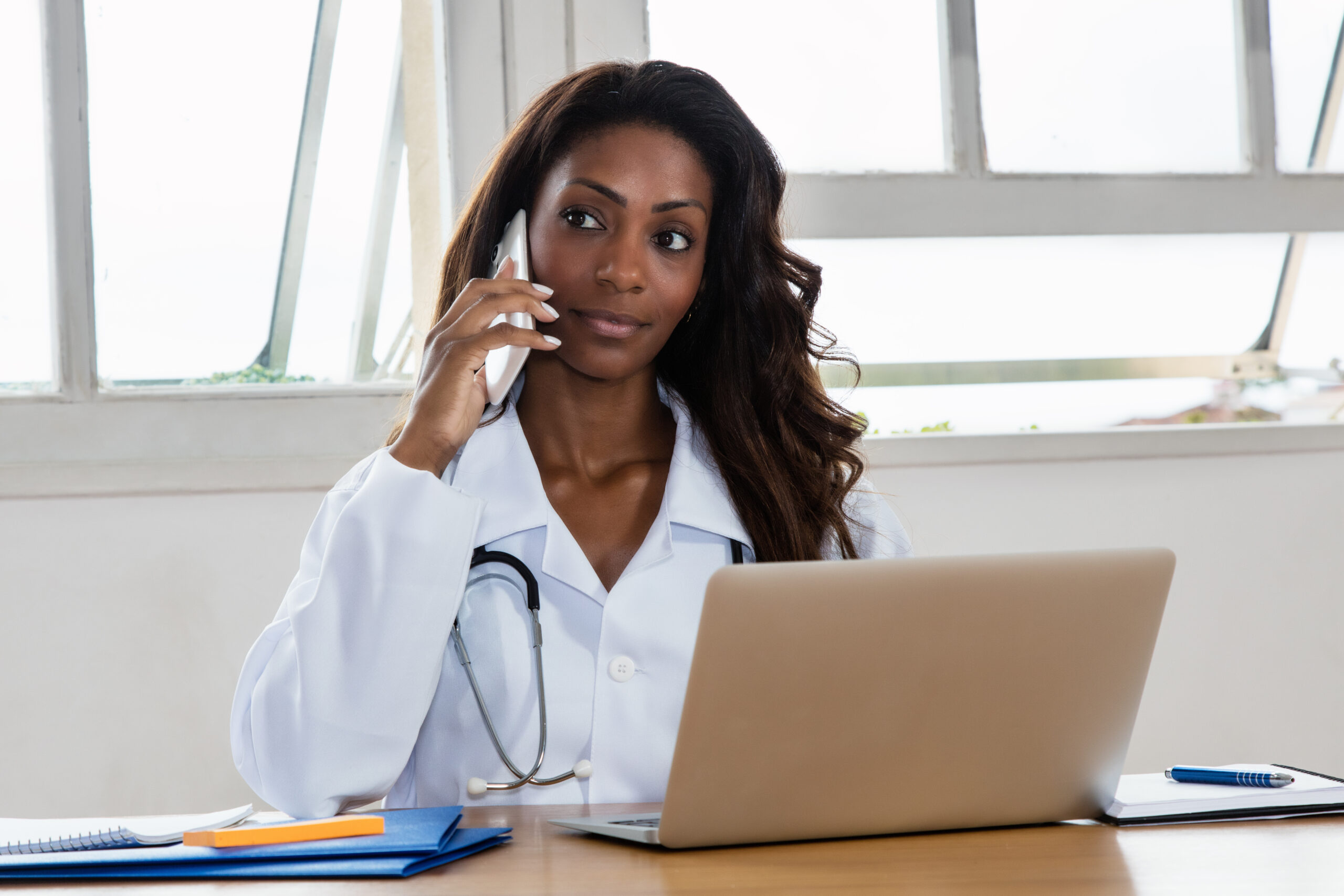 Female physician talking on the phone